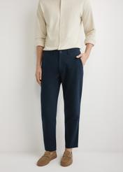 Men's navy blue trousers SPOMT-0120-7E(W26), front view of the product on the model. Half silhouette visible.