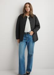 Women's black quilted jacket KURDT-0580-99(W26) - front view of the product, on a model, against a light background. Full body visible.