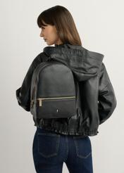 TORES-0898D-99(Z25) women's black leather backpack, front view of the product on a model. Half of the silhouette visible.