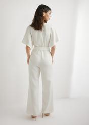 Women's cream jumpsuit KOBDT-0013-0B(W26), back view of the product on the model. Full body visible.