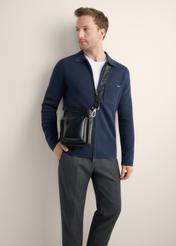 Black leather men's bag TORMS-0530-99(Z26), product view from the front on model U. Half of the silhouette visible.