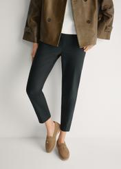 Beige leather women's moccasins BUTYD-1256-1B(W26), front view of the product on the model's feet.