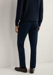 Men's navy blue trousers SPOMT-0115-7E(W26), rear view of the product on the model. Half of the silhouette visible.