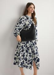 Black women's shopper bag TOREC-1238-99(W26), product view on model's shoulder. Half of silhouette visible.