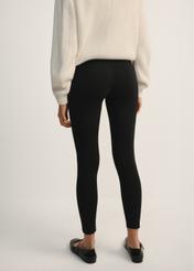 Black women's leggings LEGDT-0001-99(Z25), product view from the back on the model, half of the silhouette visible.
