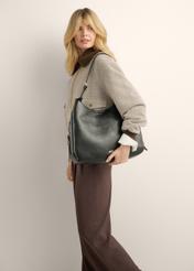 Black shoulder shopper bag TOREC-1366-9I(Z26), product view on model's shoulder. Half of silhouette visible.