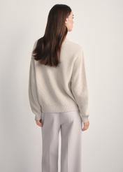 Beige women's sweater SWEDT-0238-81(Z25), back view of the product on the model. Half of the silhouette visible.