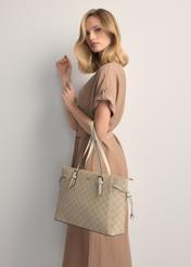 Cream shopper bag with monogram TOREC-1029-0P(W26), front view of the product on the model's silhouette.