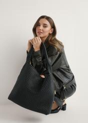 Black woven women's handbag TOREC-1147-99(W26) - front view of the product, held by the model in her hand, against a light background.