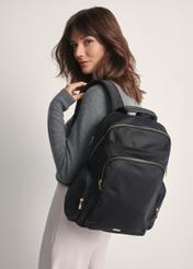 Large black women's backpack TOREN-0321-99(Z25) - front view of the product on a model against a white background. Half of the back is visible.