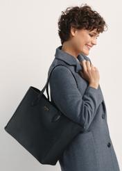 Black leather women's shopper bag TORES-0971F-99(W26), front view of the product on a model, half of the silhouette visible.