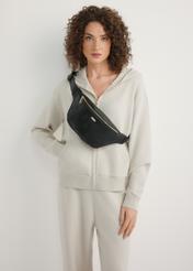 Black women's waist bag with monogram TOREC-1158-9P(W26), front view of the product on the model's silhouette.