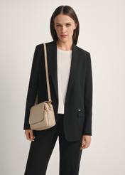 Beige leather women's messenger bag TORES-0958E-1B(W26), diagonal view of the product on the model, half of the silhouette visible.