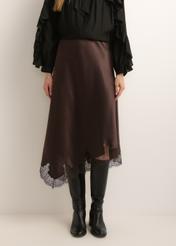 Dark brown asymmetrical women's skirt SPCDT-0135-1I(Z26), front view of the product on the model. Half of the silhouette visible.