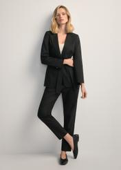 Women's black belted blazer ZAKDT-0030-99(W25), front view of the product on the model. Full body visible.