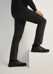 Black leather men's sports shoes BUTYM-0476-99(Z25), side view of the product on the model, half of the silhouette visible.