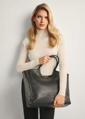 Spacious women's bag TOREC-1084-99(Z25), front view of the product on the model, half of the silhouette visible.