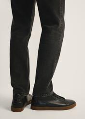 Men's leather sneakers BUTYM-0405B-99(Z25), side view of the product on the model, half of the silhouette visible.