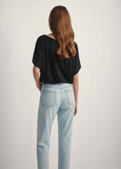 Women's black ribbed blouse BLUDT-0170-99(W25), back view of the product on the model. Half of the silhouette visible.