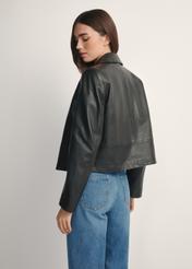 Black short women's leather jacket KURDS-0598-99(W26), product view from the back on the model, half of the silhouette visible.