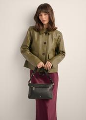 Women's black handbag made of genuine pea leather TORES-1424-9I(Z26), front view of the product on a model. Half of the silhouette visible.