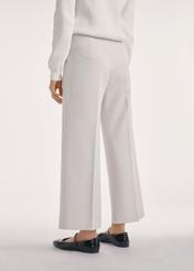 Light beige wide women's trousers SPODT-0118-80(Z25), product view from the back on the model, half of the silhouette visible.