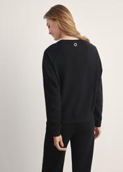 Black women's sweatshirt BLZDT-0114-99(Z25), product visible from the back on the model, half of the silhouette visible.