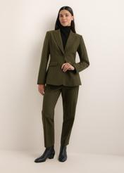 Green women's trousers with wool SPODT-0136-8B(Z26), front view of the product on the model. The entire silhouette is visible.
