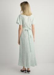 Long floral dress SUKDT-0233-8P(W26), back view of the product on the model. Full body visible.