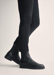 Black leather men's Chelsea boots BUTYM-0462-99(Z25), product view on model's feet against a light background.