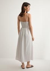 White linen midi dress with straps SUKDT-0279-0B(W26), back view of the product on the model. Full body visible.
