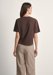 Women's brown cotton T-shirt TSHDT-0138-1I(W26), product view from the back on the model, half of the silhouette visible.