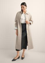Long beige women's coat KURDT-0692-1J(Z26), product view from the front on the model, the whole silhouette is visible.
