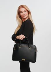 Black women's laptop bag TOREC-0978A-99(Z25) - front view of the product on a model against a white background. Knee-length silhouette visible from the side.