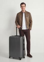 Large suitcase on wheels WALAB-0073-9C-28(W26), diagonal view of the product next to the model's silhouette.