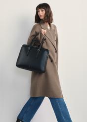 Black women's laptop bag TOREC-1108-99(Z25), front view of the product on a model, the entire silhouette is visible.