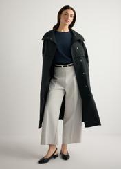 Women's black long coat KURDT-0653-99(W26), front view of the product on the model. Full body visible.