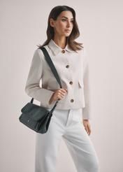 Black classic women's handbag TOREC-1124-99(W26), front view of the product on the model's shoulder. Half of the silhouette visible.