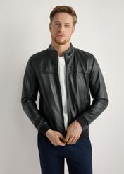 Men's black leather jacket KURMS-0392-99(W26) - front view of the product, on a model, against a light background. Half of the silhouette visible.