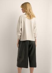 Light beige women's sweater SWEDT-0263-1A(Z26), back view of the product on the model. Half of the silhouette visible.