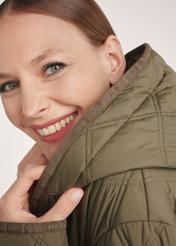 Olive quilted women's jacket KURDT-0579-57(Z25), close-up of the product detail on the model, face visible.
