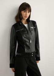 Women's black leather jacket KURDS-0587-99(W26), front view of the product on the model. Half of the silhouette visible.