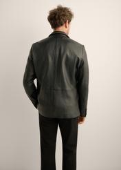 Black vintage men's leather jacket KURMS-0402-9J(Z26). Rear view of the product on a model. Half of the silhouette is visible. 