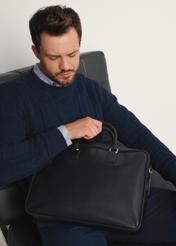 Spacious men's bag made of black leather TORMS-0471-99(Z25), front view of the product on the model, half of the silhouette visible.