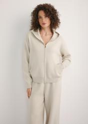 Beige women's hooded sweatshirt BLZDT-0120-1A(W26), front view of the product on the model. Half of the silhouette visible.