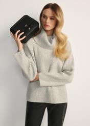 Black two-compartment shoulder bag TOREC-0405C-99(Z25), front view of the product on a model, half of the silhouette visible.