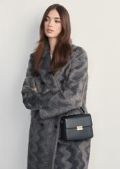 Black women's handbag TOREC-1080-99(Z25) - front view of the product on a model, against a white background. Knee-length silhouette visible.