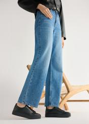 Women's high-top black leather sneakers BUTYD-1062-99(W26) - side view of the product, on a model, against a light background. Knee-length silhouette visible.