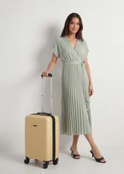 Small suitcase on wheels WALAB-0083-2B-19(W26), diagonal view of the product next to the model's silhouette.