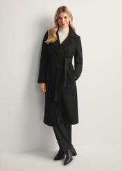 Black long women's coat PLADT-0048B-99(Z25), front view of the product on the model, the entire silhouette is visible.